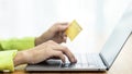 Asian Woman holding bank business credit card with computer laptop, Woman hand holding bank credit card, Paying using credit card Royalty Free Stock Photo