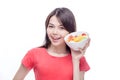 Asian woman holding bowl of fruit Royalty Free Stock Photo