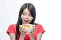 Asian woman holding bowl of fruit Royalty Free Stock Photo