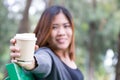 Asian woman holding coffee disposable cup Royalty Free Stock Photo