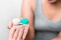 Asian woman holding contact lens on white background, Selective focus on contact lens , myopia and eyesight problem concept Royalty Free Stock Photo