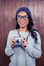 Asian woman holding digital camera Royalty Free Stock Photo