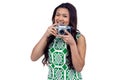 Asian woman holding digital camera Royalty Free Stock Photo