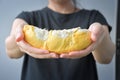 Asian woman holding fresh durian ready to eat from the garden ready to be delivered to customers