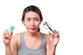 Asian woman holding glasses and contact lens on isolate on white background with clipping path, Selective focus on glasses , Royalty Free Stock Photo