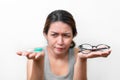 Asian woman holding glasses and contact lens on white background, Selective focus on glasses , myopia and eyesight problem concept Royalty Free Stock Photo