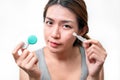 Asian woman holding glasses and contact lens on white background, Selective focus on glasses , myopia and eyesight problem concept Royalty Free Stock Photo