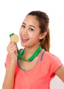 Asian woman holding gold medal. Royalty Free Stock Photo