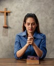 Asian woman holding hands To ask for and pray from God On the day of Christ`s church in every week. Concept believe faith prayer Royalty Free Stock Photo