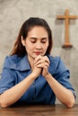 Asian woman holding hands To ask for and pray from God On the day of Christ`s church in every week. Concept believe faith prayer