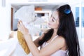 Asian woman holding her dog at home Royalty Free Stock Photo