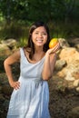 Asian woman holding mango Royalty Free Stock Photo