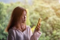 Asian woman holding a phone with her stress, sadness, despair, sorrow, and facial expression