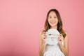 Asian woman holding purifying mask face on hands