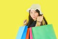 Asian woman holding shopping bags for girl fashion shopping in the summer colorful yellow Royalty Free Stock Photo