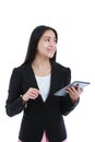 Asian woman holding tablet computer, isolated on white background, working on touching screen. Royalty Free Stock Photo