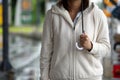 Asian woman holding umbrella while waiting taxi and standing on the city sidewalk street in rainy day Royalty Free Stock Photo