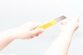 Asian woman holding a yellow box cutter knife Royalty Free Stock Photo