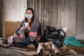 Asian woman homeless wearing hygiene face mask for protective infection and pandemic of coronavirus or covid19