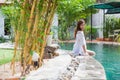 Asian Woman In Hotel Swimming Pool Relaxing Vacation Travel, Young Girl Enjoying Spa Royalty Free Stock Photo