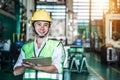 Asian woman is industrial engineer or QC team holding the clipboard Royalty Free Stock Photo