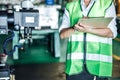 Asian woman is industrial engineer or QC team holding the clipboard Royalty Free Stock Photo