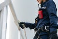 Asian woman Inspection engineer preparing and progress check of a wind turbine with safety in wind farm in Thailand