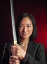 asian woman in a jacket with a katana in her hands mafia fighter emotions on her face