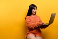 woman and laptop and are happy to work Photo of a beautiful Asian woman who is happy working at home. using a laptop Royalty Free Stock Photo