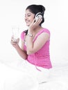 Asian woman listening to music Royalty Free Stock Photo