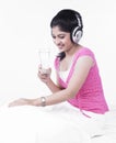 Asian woman listening to music Royalty Free Stock Photo