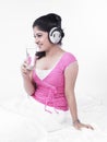 Asian woman listening to music Royalty Free Stock Photo