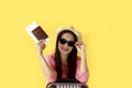 Asian women long hair wear Straw hat, sunglasses in hand holding passport book and travel bag with copy space banner. Young girl Royalty Free Stock Photo
