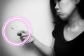 Asian woman looking at  clinical thermometer on her hand for checking temperature. With anxiety mood. Black and white tone with Royalty Free Stock Photo