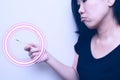 Asian woman looking at  clinical thermometer on her hand for checking temperature. With anxiety mood. with circle wave on Royalty Free Stock Photo