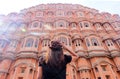 An Asian woman looking at Hawa Mahal