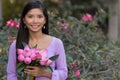 Asian woman with lotus flowers