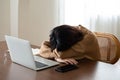 Asian woman lying face down on the table Royalty Free Stock Photo