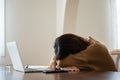 Asian woman lying face down on the table Royalty Free Stock Photo