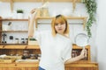 Asian woman making healthy food standing happy smiling in kitchen preparing salad. Beautiful cheerful Asian young woman at home. Royalty Free Stock Photo