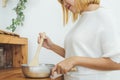 Asian woman making healthy food standing happy smiling in kitchen preparing salad. Royalty Free Stock Photo