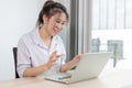 Asian woman making video calls on her laptop in the private office of her home Royalty Free Stock Photo