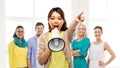 Asian woman with megaphone over group of people