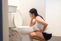 Asian woman with morning sickness,Pregnant female nausea into the toilet bowl