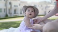 Asian woman mother playing with happy baby infant in garden on sunny day under tree on picnic vacation. smile baby happy fun