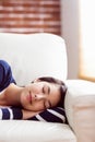 Asian woman napping on the couch Royalty Free Stock Photo