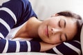 Asian woman napping on the couch Royalty Free Stock Photo