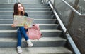 Asian woman with paper map in city Royalty Free Stock Photo