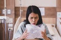 Asian woman patient puke or vomiting into plastic bag at hospital,Nausea,Indigestible Royalty Free Stock Photo