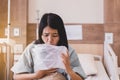 Asian woman patient puke or vomiting into plastic bag at hospital,Nausea,Indigestible Royalty Free Stock Photo